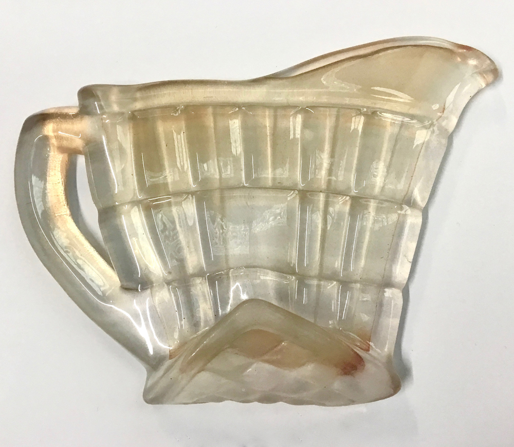 Palimpsest: orange milk jug Palimpsest: orange milk jug